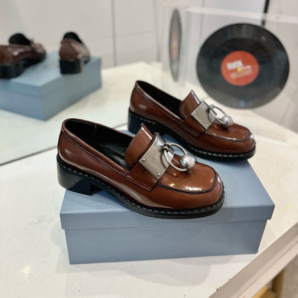 PRADA Brushed leather loafers with metal details